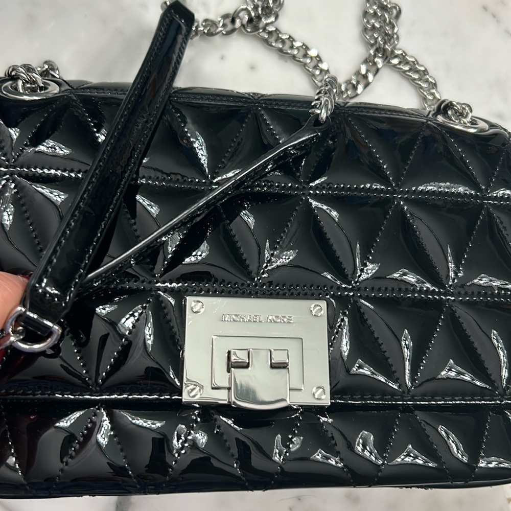 Michael kors patent leather handbag.